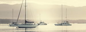 Sailboats in a quiet harbour - Adventure Marine Lifestyle